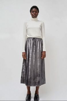 Wardrobe essential midi skirt in a dynamic metallic silver. easily dresses up or down. super comfortable drawstring closure. Tea Length Metallic Skirt, Chic Metallic Shiny Skirt, Chic Metallic Flowy Skirt, Elegant Metallic Midi Skirt, Metallic Midi Skirt, Long Skirts For Women, Pony Hair, Gold Silk, A Perfect Circle