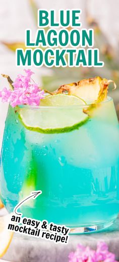 the blue lagoon cocktail is served in a glass with lime and pink flowers on top