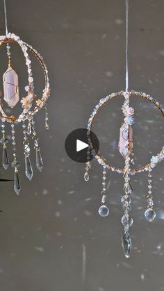 two chandeliers hanging from the ceiling with crystal beads and crystals attached to them