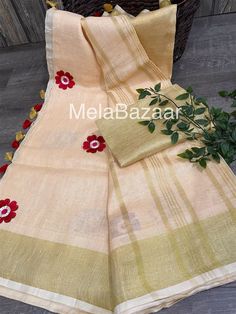 Beautiful and trendy saree ! 100 count pure linen Saree with embroidered flowers and gold zari border ! Saree falls nicely and pleats easy ! Fall attached. Blouse fabric included Unstitched Slub Silk Saree With Floral Embroidery, Embroidered Summer Saree In Traditional Drape, Gold Chanderi Saree With Floral Embroidery, Gold Slub Silk Sets With Embroidered Border, Summer Embroidered Unstitched Saree, Summer Chanderi Dupatta With Embroidered Border, Designer Summer Dupatta With Embroidered Border, Summer Designer Embroidered Saree, Summer Celebration Dupatta With Pallu Detail