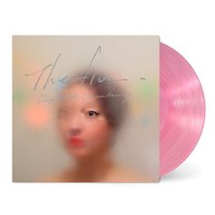 a pink vinyl record with the words we are on it and an image of a woman's face