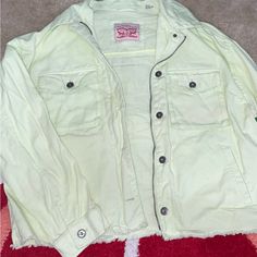 Super Pale Mint Green With A Hint Of Yellow Oversized Levi Jacket. Never Worn, Kept In A Drawer. Fuzz On Back Has Been Removed, Just Due To Being Folded. Raw Bottom Hem. Zipper Is Just For Style, Does Not Zip. Casual Yellow Relaxed Fit Outerwear, Casual Yellow Top With Pockets, Casual Yellow Tops With Pockets, Relaxed Fit Yellow Outerwear With Pockets, Yellow Button-up Casual Outerwear, Yellow Relaxed Fit Outerwear With Pockets, Yellow Casual Button-up Outerwear, Oversized Yellow Top With Pockets, Oversized Yellow Tops With Pockets