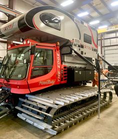 a train being worked on in a garage