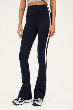 High waisted for flattering shaping Double contrast side stripes Below ankle length tight with flared leg Form fitting, true to size Smooth, chafe-free flatlock seams Reflective 59 logo Imported Barre Pilates, Flare Legging, High Waisted Flares, Flare Leggings, Striped Leggings, Pajama Bottoms, Side Stripe, Shirt Accessories, Yoga Clothes