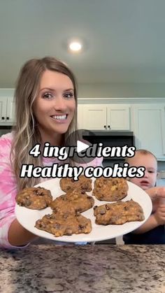 a woman holding a plate with cookies on it and the words 4 ingredients for healthy cookies