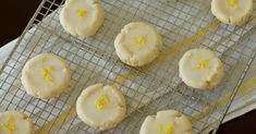 lemon cookies are cooling on a wire rack