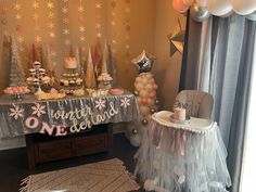 a birthday party with balloons, cake and decorations