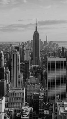 black and white photograph of new york cityscape with empire building in the background