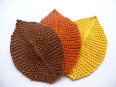 three knitted hats sitting on top of each other