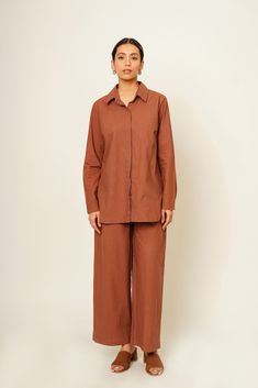 "Introducing our Almond Brown Summer Co-ord set, where comfort meets style effortlessly. Crafted from organic cotton, this set features an oversized shirt and pants combination, offering a smart yet comfy casual outfit perfect for the season. The breathable fabric ensures you stay cool and relaxed whether you're lounging at home or exploring new destinations. Customizable in plus sizes, it's tailored to flatter all body types, making it the ideal travel leisurewear for your summer adventures.  Length Top: 27 inches, Pant length: 38 inches  Quality: Soft and light Care: Hand wash with light detergent or dry clean Ships within 3-5 working days For quicker delivery please send us a message. Additional Information: Colour: Peachy Glow Feel: Soft and light. Availability: Made to order. Fabric: Casual Cotton Loungewear Pant Set, Casual Cotton Pant Set With Straight Pants, Casual Cotton Wide Leg Sets, Brown Cotton Sets For Fall, Fall Brown Cotton Sets, Casual Relaxed Fit Cotton Pant Set, Casual Pant Set With Relaxed Fit Straight Pants, Relaxed Fit Solid Color Workwear Sets, Casual Brown Sets With Relaxed Fit