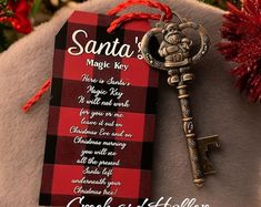 a red and black plaid christmas ornament with a key to santa's magic key