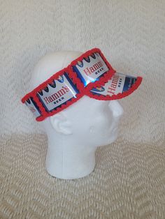 a white mannequin head with red, white and blue glasses on top of it