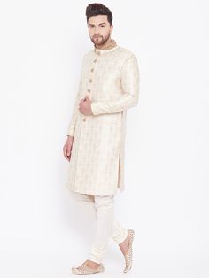 VASTRAMAY Men's Beige And Gold Embroidered Brocade Sherwani Set The VASTRAMAY Men's Beige And Gold Embroidered Brocade Sherwani Set embodies timeless sophistication with its intricate embroidery and luxurious brocade fabric. Perfect for weddings and formal occasions, this sherwani set promises a blend of traditional craftsmanship and contemporary style. Features of VASTRAMAY Men's Beige And Gold Embroidered Brocade Sherwani Set Elegant beige and gold color combination for a regal appearance. Ela Festive Long Sleeve Traditional Fit Sherwani, Festive Brocade Sherwani With Chikankari Embroidery, Transitional Naqshi Brocade Kurta, Fitted Brocade Kurta With Chikankari Embroidery, Ceremonial Brocade Kurta With Chikankari Embroidery, Embroidered Brocade Sherwani Straight Kurta, Long Sleeve Brocade Kurta With Chikankari Embroidery, Brocade Long Sleeve Kurta With Chikankari Embroidery, Ceremonial Gold Sherwani With Self Design