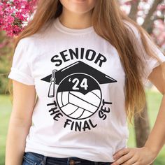 a young woman wearing a white shirt with the words senior on it