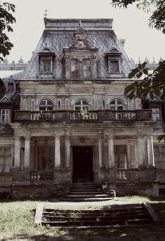 an old building with stairs leading up to it