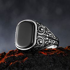 Baroque patterned ring is carefully designed for you. Ring grams vary depending on the size . Our products are made of 925 sterling silver and comfortable to use daily. It has an oxidized surface that gives it an old and solid appearance. With its detailed handmade engravings, this silver ring will catch some serious attention and make a beautiful gift for your beloved ones. All of our products are packed in jewelery boxes ready to be gifted. Handcrafted with love and care, this ring will be with you for years to come. Item Details * Material : 925K Sterling Silver * Total weight : 6-10 g * Gemstone : Black Onyx * Gemstone Size : 16x10   Care Guide   Unfortunately, 925 sterling and all other silver types tarnish in time. So the question is; How can we slow it down?  * Contact with water: N Black Stainless Steel Engraved Ring As Gift, Black Stainless Steel Engraved Ring For Gift, Black Stainless Steel Engraved Ring, Adjustable Black Engraved Ring, Black Sterling Silver Engraved Ring, Engraved Black Rings For Gift, Vintage Black Engraved Ring Stamped 925, Black Vintage Engraved Ring Stamped 925, Motif Baroque