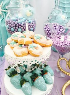 a table topped with lots of desserts and sweets