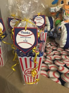 baseball themed candy boxes with thank you for the ball game on them and teddy bears in the background