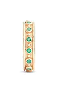 Bezel-set emeralds enhance the gleaming allure of this handcrafted 14-karat-gold ring that brings to mind sun-dappled days on hot Mediterranean beaches. 14k gold/emerald Made in Canada Luxury Green Emerald Stackable Ring, Multi-stone Emerald Diamond Ring For May Birthstone, Luxury Stackable Emerald Jewelry, Heirloom Style Emerald Ring With Halo, Heirloom Emerald Ring With Halo, Emerald Multi-stone Jewelry For May Birthstone, Luxury Stackable Yellow Gold Emerald Ring, Luxury Yellow Gold Stackable Emerald Ring, Heirloom Style Stackable Emerald Ring