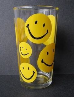 a glass with smiley faces painted on it