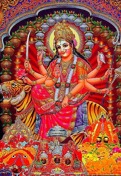 the hindu goddess sitting on top of a tiger