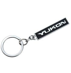 a keychain with the word yukon on it's front and back sides