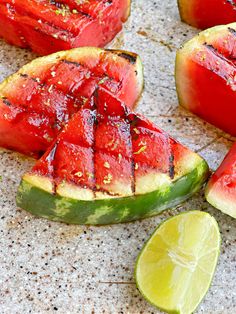 slices of watermelon and lime on a table