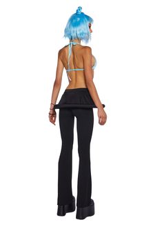 a woman with blue hair wearing black pants and a halter top, back view