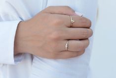 The Colette ring is formed by one band with 3 bezel setting cubic zirconias on the front part. The central cubic zirconia is slightly bigger than the other two. This dainty, tiny, shiny ring looks great when worn alone as well as when stacked with other rings. Features: * Available sizes (US): 5, 6, 7 and 8. * All of our jewelry is made with sterling silver (925 mm) and our gold jewelry is gold plated in 18K gold. Nickel free. Packaging: Our jewelry is packaged in a reusable bag that protects th Everyday Cubic Zirconia Rings With Bezel Setting, Minimalist Three Stone Promise Ring Jewelry, Minimalist Three Stone Jewelry For Anniversary, Minimalist Three Stone Jewelry, Minimalist Three-stone Ring Jewelry, Shiny Rings, Rings Etsy, Ring Minimalist, Minimalist Rings