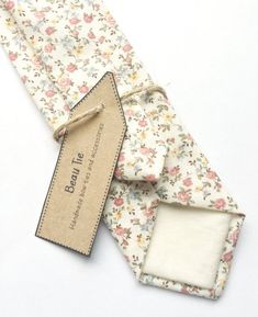 DESCRIPTION: This lovely men's skinny tie has been handmade using a beautiful vintage first floral cotton.FABRIC: Cotton.LINING FABRIC: Cotton.--------------------------------------------------------------------------------------------DETAILS:• Made the traditional way with fabric cut on the bias• Each tie has canvas lining throughout• Fabric lining just at the tip on each end of the tie• Width at the widest part measures approx 2.5 inches• The length of each tie is approx 58 Inches• Comes packa Elegant Cotton Ties For Gifts, Vintage Adjustable Ties For Gifts, Vintage Adjustable Ties For Gift, Vintage Adjustable Ties As A Gift, Classic Ties For Spring Gifts, Classic Ties For Spring Season Gifts, White Cotton Ties For Gifts, Classic Floral Print Tie For Gift, Cotton Standard Tie Perfect For Gifts