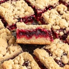 blueberry crumb bars cut into squares on top of each other, ready to be eaten