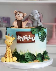 there is a cake decorated with animals on it