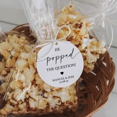 a basket filled with lots of popcorn sitting on top of a table