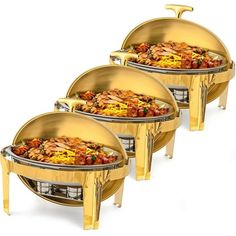 three large gold grills with different types of food on them