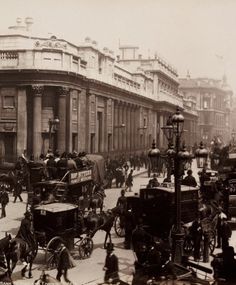 an old black and white photo of horse drawn carriages