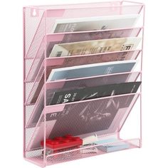 a pink desk organizer with five compartments and two pens on top of the bins