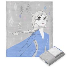 an image of a frozen princess blanket and pillow set with the cover pulled back to show her face