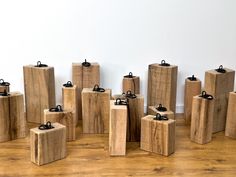 several pieces of wood are arranged in the shape of cubes with black metal handles