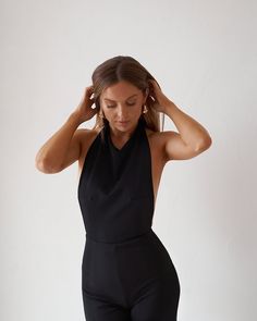 Evening Backless Jumpsuits And Rompers, Backless Evening Jumpsuits And Rompers, Stretch Backless Jumpsuits And Rompers For Evening, Backless Jumpsuit With Tie Back For Night Out, Backless Tie-back Jumpsuit For Night Out, Stretch Halter Neck Bodysuit For Evening, Backless Jumpsuit With Tie Back For Date Night, Fitted Jumpsuit With Back Opening For Date Night, Fitted Jumpsuit With Tie Back For Date Night