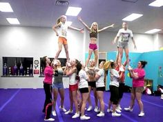 a group of young women standing on top of each other