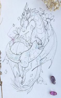 a drawing of a dragon sitting on top of a table next to some rocks and flowers