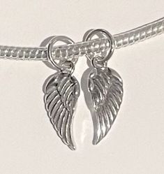 Pandora Style Set of 2 Angel Wings Dangle Charm , Angel Wings charm , 925 Sterling Silver A SPECIAL CHARM FOR A LOVED ONE ! KEEP 1 AND GIFT THE OTHER ! Add this to your bracelet or as a gift. I do not accept returns. Sales are final unless damaged. Pandora Angel, Pandora Style, Pandora Bracelets, Dangle Charms, Angel Wings, Fashion Set, 925 Sterling Silver, Angel, Bracelet