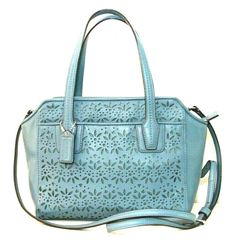 Coach Taylor Eyelet Leather Mini Tote Crossbody Handbag #F28081 Leather Inside zip and multifunction pockets Zip-top closure, fabric lining Outside two open pockets Handles with 8" drop Adjustable strap for shoulder or crossbody wear 22" drop 13" (L) x 8" (H) x 3 3/8" (W) Condition: very good, pre-owned. Clean inside and outside. Comes from smoke free home. Color concern: Please keep in mind all computer monitors are not the same and when you receive your item the color may not match the color o Coach Taylor, Home Color, Mini Tote, Computer Monitors, Leather Mini, Zip Top, Cross Body Handbags, Bags Handbags, Adjustable Straps