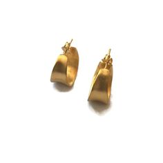 Modern small gold hoops with a modern antiquity feel to them. Cast in silver and plated in 18 K gold.  Light weight post earrings  Details:20 mm diameter .8 inchesWidth at widest point 10 mm  .4 inchesI other hoops in this series https://www.etsy.com/shop/SHERIBERYL?ref=seller-platform-mcnav&search_query=concave+hoopsJoin the club! be in the know for sales, new products , special promotions & flash sales! and receive a GIFT CARD  http://eepurl.com/qhQIv Contemporary Small Hoop Earrings As Gift, Elegant Gold Hammered Huggie Earrings, Elegant Handmade Yellow Gold Huggie Earrings, Elegant Hammered Gold Huggie Earrings, Handmade Yellow Gold Huggie Earrings, Handmade Gold Huggie Earrings In Brass, Handmade Gold Brass Huggie Earrings, Modern Brass Huggie Earrings As Gift, Contemporary Yellow Gold Hoop Earrings