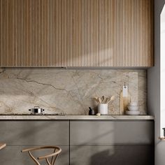 a modern kitchen with marble counter tops and wooden blinds on the window sill over the sink