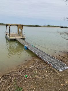 a boat dock sitting on top of a lake