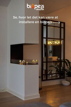 a living room filled with furniture next to a tall white wall mounted fireplace and mirror