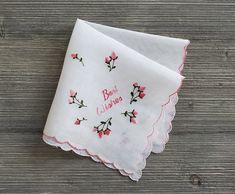 Vintage Embroidered Handkerchief ~ This lovely hankie features the message 'Best Wishes' surrounded pink rosebuds. It is made of sheer white cotton, and the tag is still attached. A well-preserved handkerchief that would fit nicely in a greeting card for a special wedding keepsake.  Measures 11 x 11 inches  Thanks for visiting → RoseAnaDana.Etsy.com . Embroidered Pink Handkerchiefs For Gifts, Pink Embroidered Handkerchiefs For Gift, Embroider Handkerchief, Handkerchief Wedding, Embroidered Handkerchief, Embroidered Roses, Vintage Handkerchief, Roses Vintage, Vintage Handkerchiefs