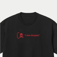 Leclerc I Am Stupid Formula One Racing T-Shirt, F1 Shirts, Funny Quotes Formula 1 Top This T-Shirt features Leclerc's most amusing quote from his racing career so far. From witty one-liners to hilarious quips, this t-shirt is sure to get a laugh from fellow racing fans and anyone who loves a good joke. The T-Shirt is both comfortable and durable, ensuring that it will last for many wears to come. The design features bold and playful typography, showcasing Leclerc's humour and sometimes annoyed moments. It is the perfect T-Shirt for anyone who wants to show their support for Leclerc while also adding some humour and personality to their wardrobe. It's suitable for casual wear, workouts, or even as a conversation starter at the racetrack. #0900 Short Sleeve Sweatshirt With Logo For Streetwear, Red Crew Neck T-shirt With Graphic Print, Black Short Sleeve Sweatshirt With Graphic Print, Short Sleeve Graphic Tee Sweatshirt With Logo Print, Funny Text Crew Neck Shirt For Streetwear, Streetwear Funny Text Crew Neck Shirt, Crew Neck Shirt With Funny Text For Streetwear, Black Crew Neck Sweatshirt With Funny Text, F1 Clothes