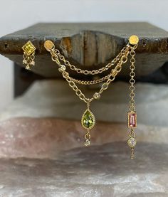 Cris Blackwater | Fine Jewelry on Instagram: “14k yellow gold Peridot and diamond threadless end + peridot, pink sapphire and diamond triple conch chain for the lovely…” Diy Cartilage Earrings, Curated Piercings, Triple Conch, Ear Project, Bvla Jewelry, Ear Peircings, Daith Earrings